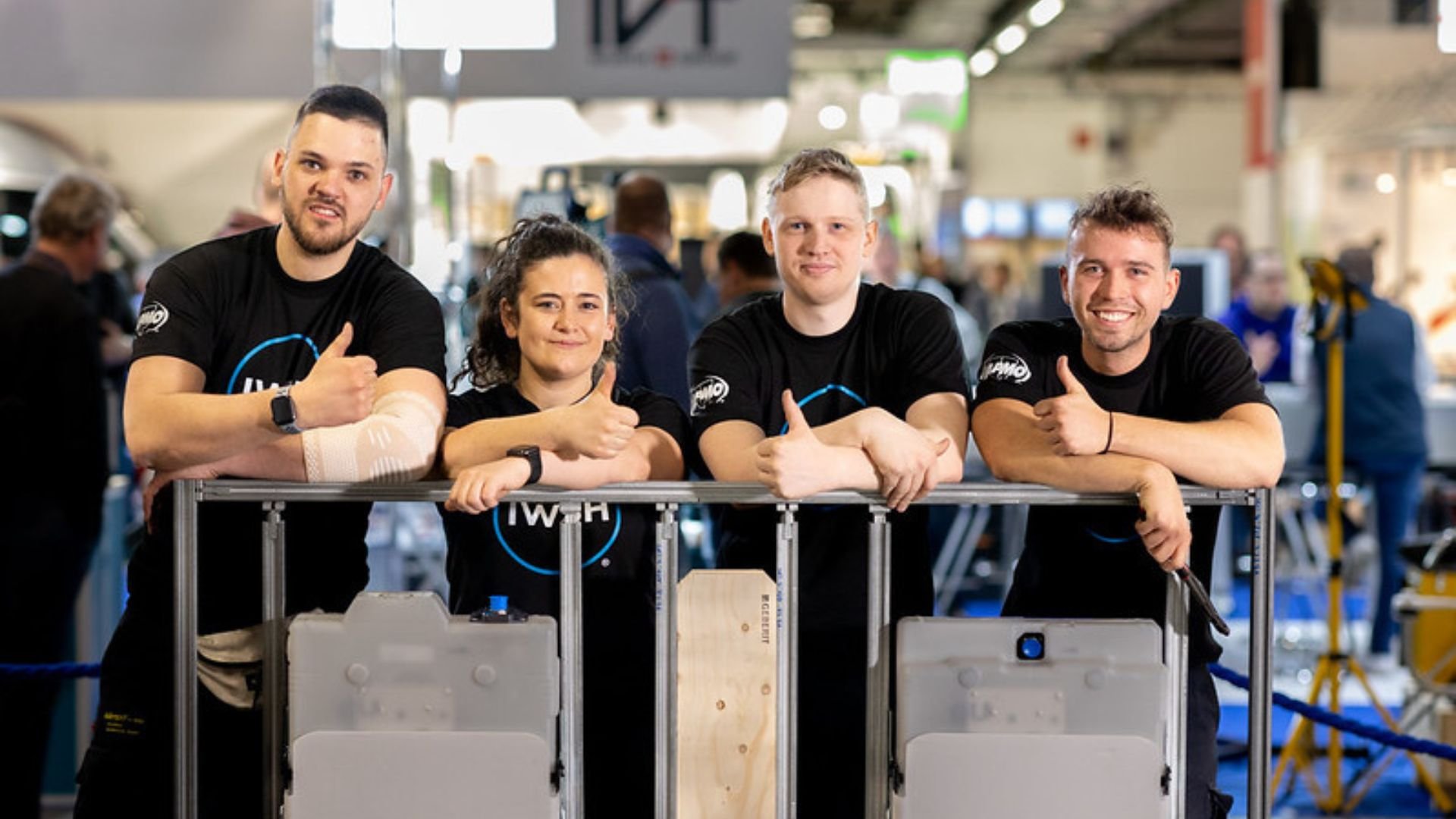Young IWSH plumbers, thumbs up