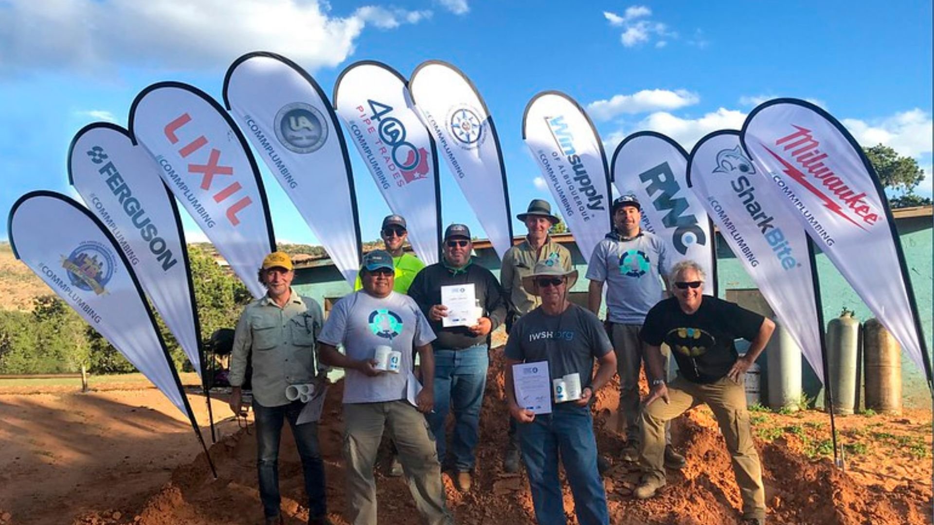 IWSH plumbers and banners at Navajo Mountain